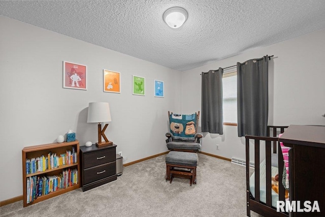 237 Colony Dr, Davenport, IA 52806 - carpeted bedroom featuring a textured ceiling and baseboards