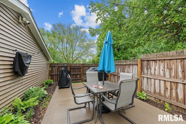 237 Colony Dr, Davenport, IA 52806 - fenced backyard with outdoor dining space and a patio