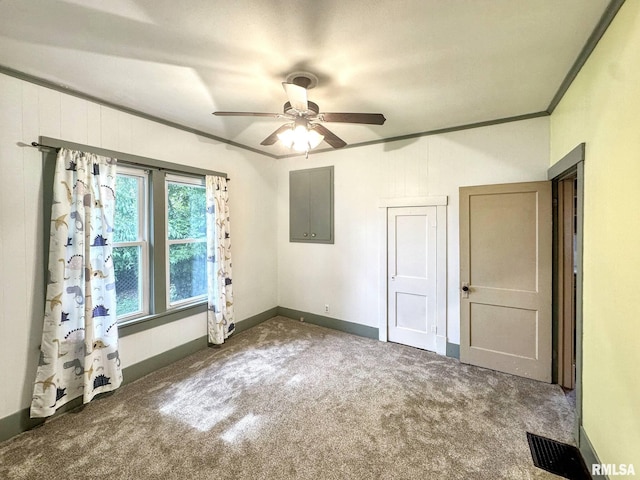 1010 W White St, Marion, IL 62959 - unfurnished bedroom featuring carpet flooring, crown molding, electric panel, baseboards, and a ceiling fan