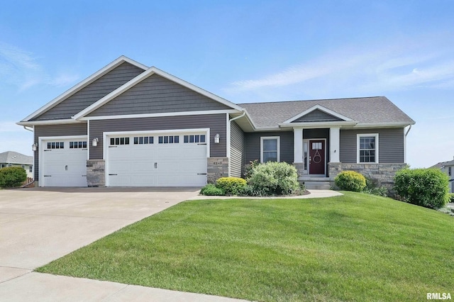4241 Colorado Dr, Bettendorf, IA 52722 - craftsman-style home featuring a garage, stone siding, and driveway