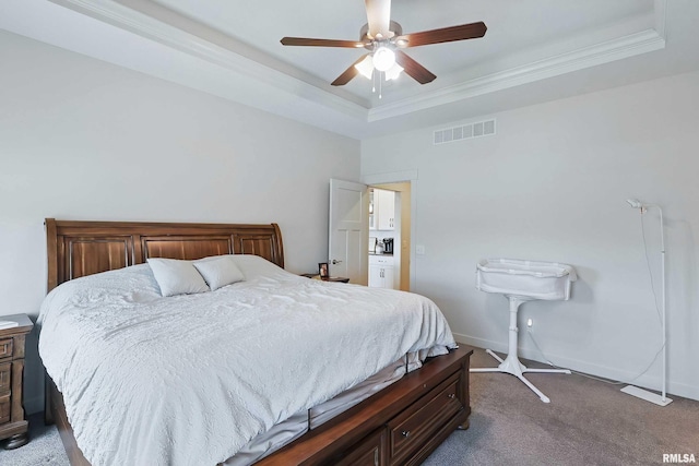4241 Colorado Dr, Bettendorf, IA 52722 - bedroom featuring a tray ceiling, dark colored carpet, baseboards, ceiling fan, and crown molding