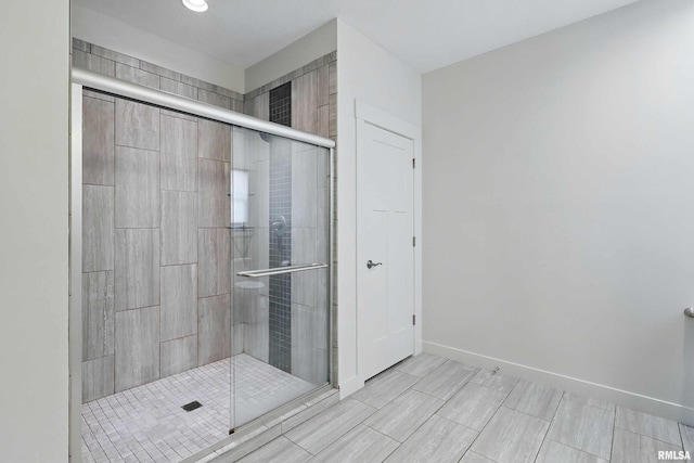 4241 Colorado Dr, Bettendorf, IA 52722 - full bath with a shower stall and baseboards