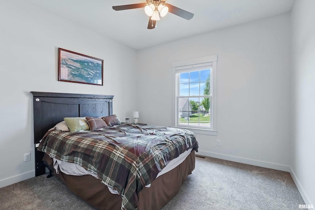 4241 Colorado Dr, Bettendorf, IA 52722 - carpeted bedroom featuring baseboards and a ceiling fan