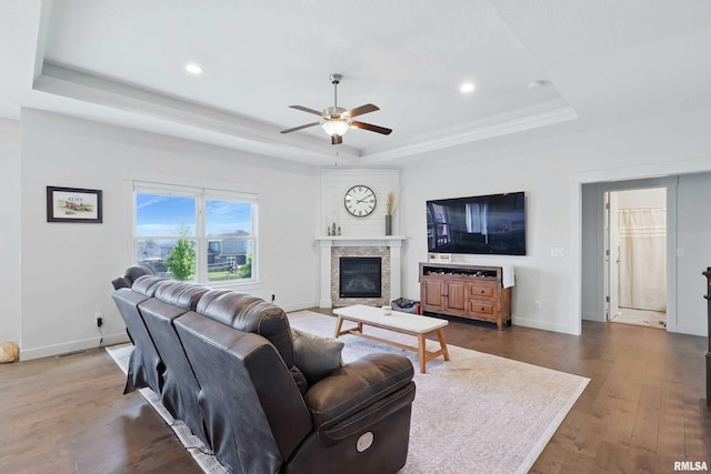 4241 Colorado Dr, Bettendorf, IA 52722 - living room with a tray ceiling, a ceiling fan, wood-type flooring, baseboards, and recessed lighting