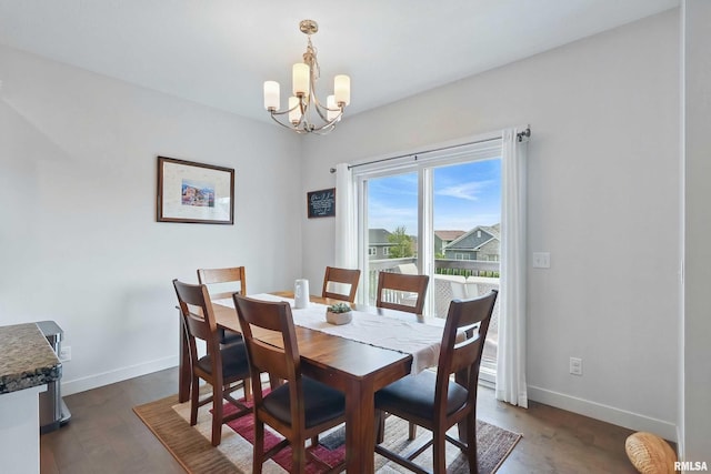4241 Colorado Dr, Bettendorf, IA 52722 - dining space with a chandelier, baseboards, and dark wood-style floors
