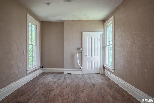 1415 Pershing Ave, Davenport, IA 52803 - foyer with wood finished floors, baseboards, healthy amount of natural light, and a textured wall