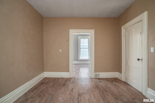 1415 Pershing Ave, Davenport, IA 52803 - empty room featuring wood finished floors and baseboards