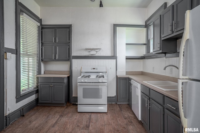 1415 Pershing Ave, Davenport, IA 52803 - kitchen with white appliances, gray cabinetry, a sink, and open shelves