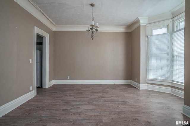 1415 Pershing Ave, Davenport, IA 52803 - empty room featuring a chandelier, wood finished floors, ornamental molding, and baseboards
