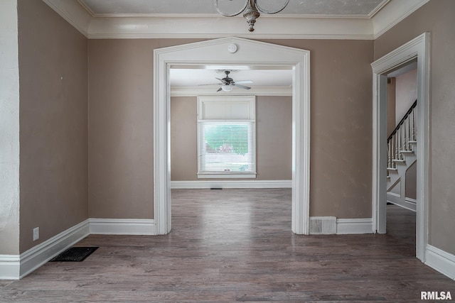 1415 Pershing Ave, Davenport, IA 52803 - hallway featuring wood finished floors, baseboards, ornamental molding, and stairway