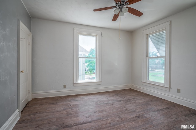1415 Pershing Ave, Davenport, IA 52803 - spare room featuring wood finished floors, ceiling fan, and baseboards