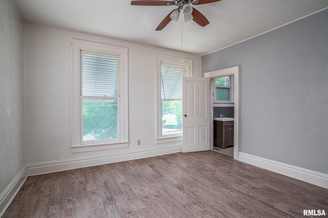 1415 Pershing Ave, Davenport, IA 52803 - empty room featuring wood finished floors, ceiling fan, and baseboards