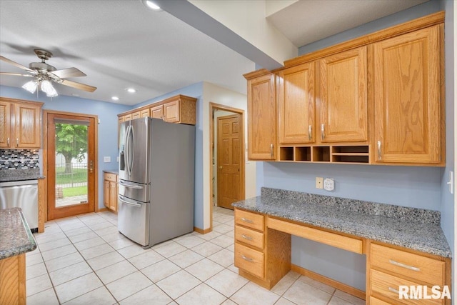 859 45th Ave, East Moline, IL 61244 - kitchen with stainless steel appliances, stone countertops, recessed lighting, ceiling fan, and light tile patterned floors