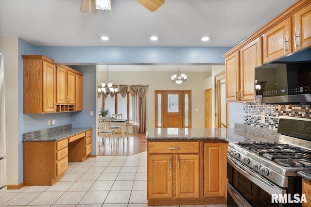 859 45th Ave, East Moline, IL 61244 - kitchen featuring range with two ovens, a chandelier, a peninsula, tasteful backsplash, and light tile patterned floors