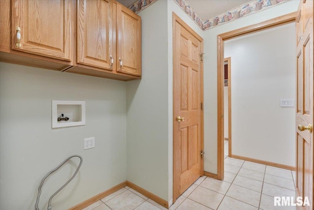 859 45th Ave, East Moline, IL 61244 - laundry area with cabinet space, hookup for a washing machine, light tile patterned flooring, and baseboards