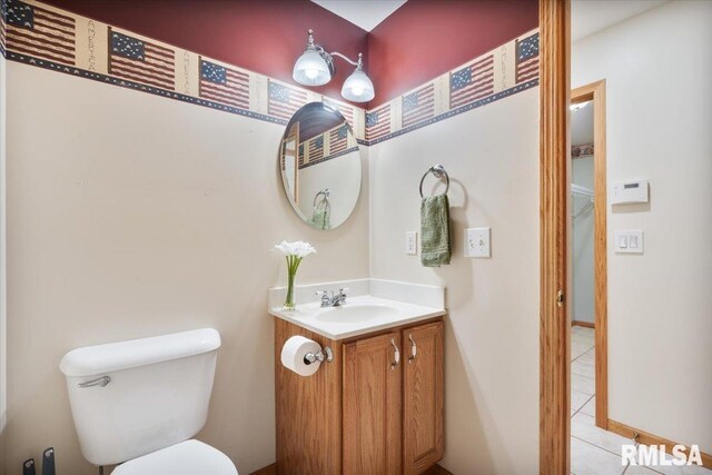 859 45th Ave, East Moline, IL 61244 - half bath with tile patterned floors, vanity, and toilet