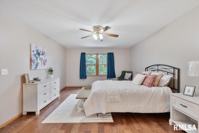 859 45th Ave, East Moline, IL 61244 - bedroom with light wood-type flooring, baseboards, and ceiling fan