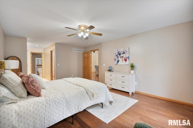 859 45th Ave, East Moline, IL 61244 - bedroom with wood finished floors, baseboards, and a ceiling fan