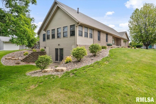 859 45th Ave, East Moline, IL 61244 - back of property with a lawn and brick siding