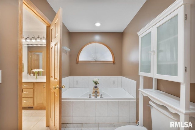 859 45th Ave, East Moline, IL 61244 - full bathroom featuring a garden tub, vanity, tile patterned flooring, and toilet