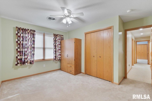 859 45th Ave, East Moline, IL 61244 - unfurnished bedroom featuring carpet floors, a closet, and baseboards
