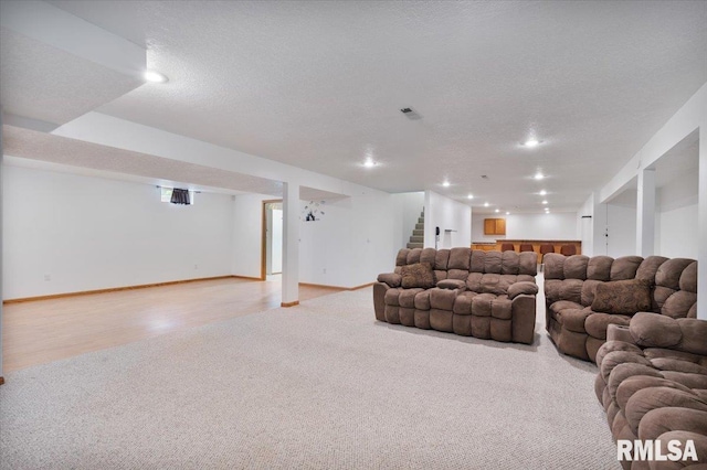 859 45th Ave, East Moline, IL 61244 - living area with carpet, stairway, recessed lighting, a textured ceiling, and baseboards