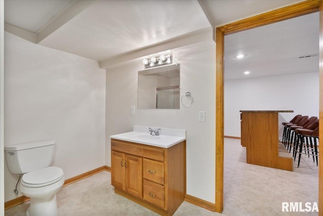 859 45th Ave, East Moline, IL 61244 - full bathroom featuring vanity, toilet, baseboards, recessed lighting, and a shower