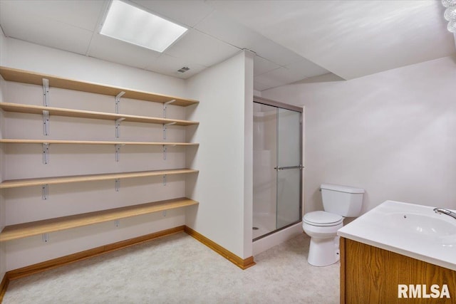 859 45th Ave, East Moline, IL 61244 - full bath with a stall shower, baseboards, toilet, vanity, and a paneled ceiling