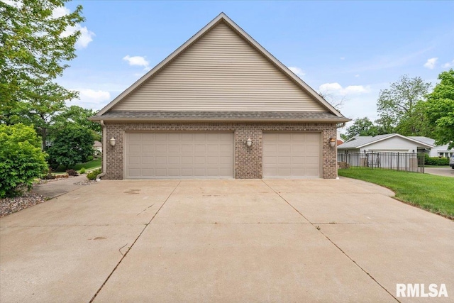 859 45th Ave, East Moline, IL 61244 - view of front facade with brick siding and a garage