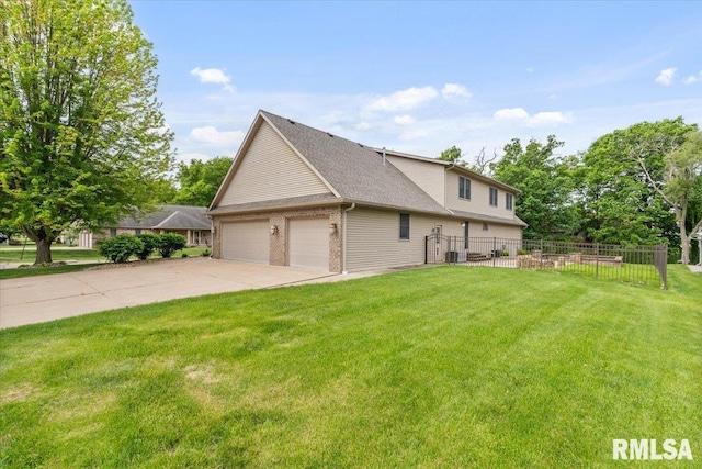 859 45th Ave, East Moline, IL 61244 - view of side of property featuring a garage, roof with shingles, and central air condition unit