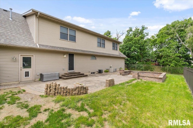 859 45th Ave, East Moline, IL 61244 - rear view of property with a patio area, a vegetable garden, and central AC unit