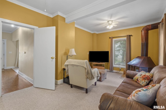 608 S Main St, Port Byron, IL 61275 - living room with a ceiling fan, crown molding, carpet flooring, and a wood stove