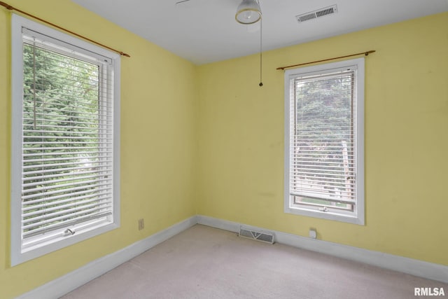 608 S Main St, Port Byron, IL 61275 - spare room featuring light carpet and baseboards