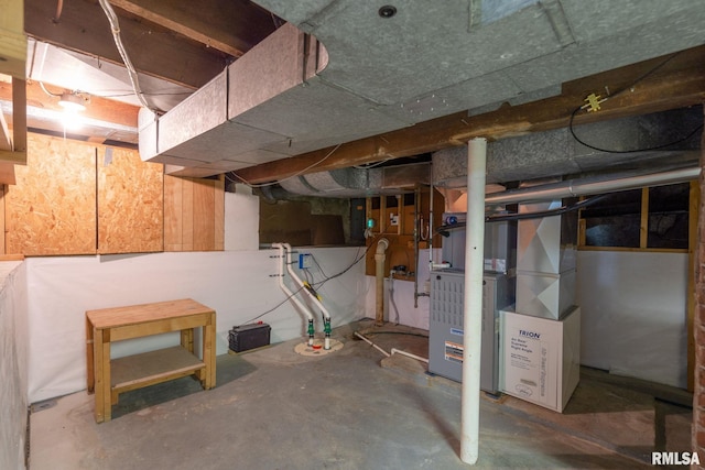 608 S Main St, Port Byron, IL 61275 - unfinished below grade area featuring heating unit and drainage system