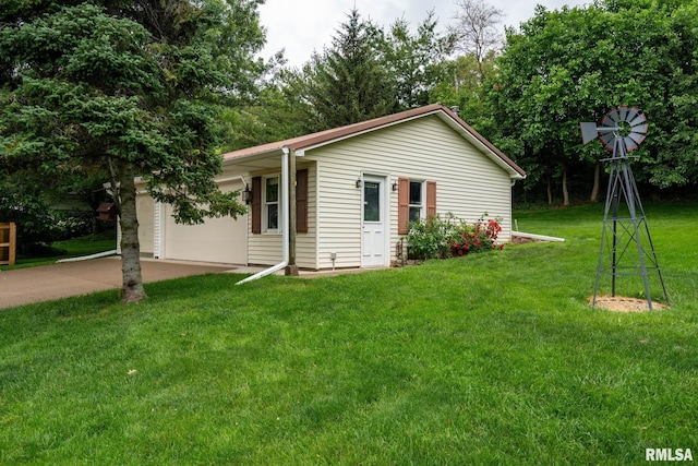 608 S Main St, Port Byron, IL 61275 - view of front of home with driveway, a front lawn, and a garage