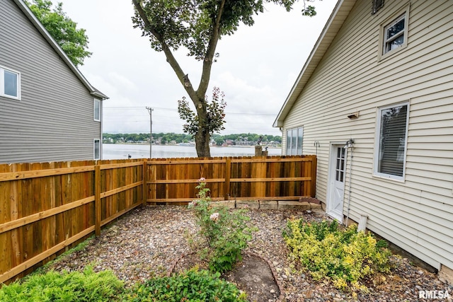608 S Main St, Port Byron, IL 61275 - fenced backyard featuring a water view