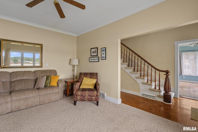 608 S Main St, Port Byron, IL 61275 - living area featuring healthy amount of natural light, ornamental molding, ceiling fan, and stairs