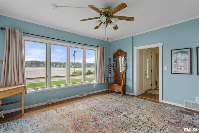 608 S Main St, Port Byron, IL 61275 - empty room with a ceiling fan, ornamental molding, a water view, and wood finished floors
