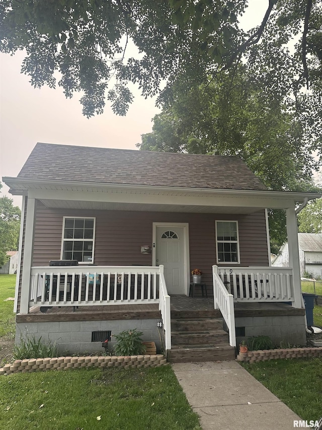119 S Elm St, Williamsfield, IL 61489 - bungalow-style house featuring a porch and roof with shingles
