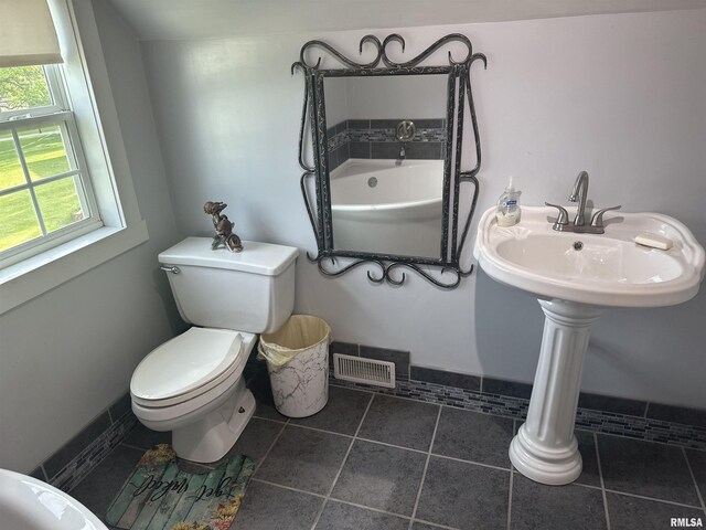119 S Elm St, Williamsfield, IL 61489 - full bath featuring toilet, a tub, and tile patterned floors