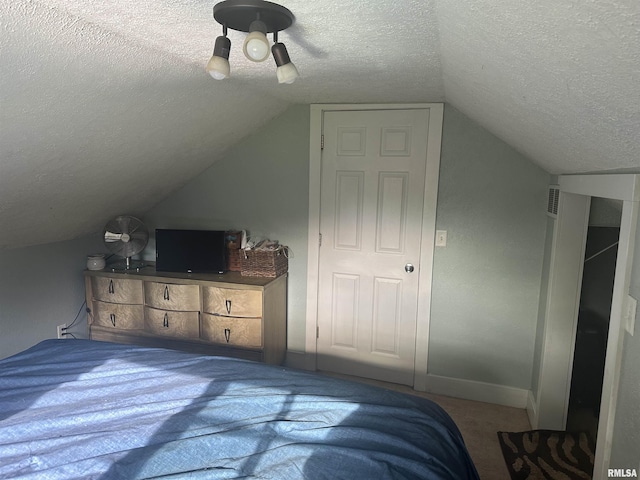 119 S Elm St, Williamsfield, IL 61489 - carpeted bedroom with a textured ceiling, lofted ceiling, baseboards, and ceiling fan