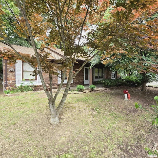 414 S Clayton St, Benton, IL 62812 - obstructed view of property featuring a front lawn and brick siding
