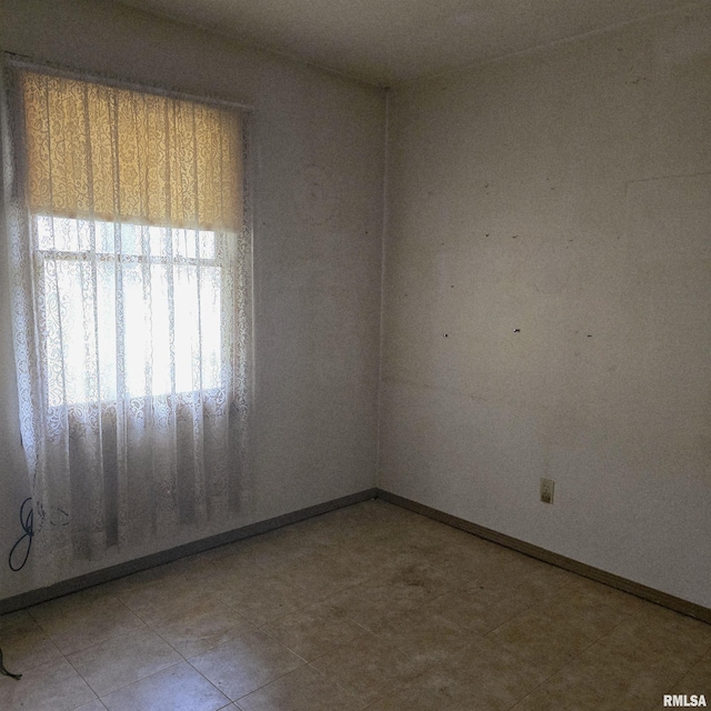 414 S Clayton St, Benton, IL 62812 - tiled empty room with baseboards