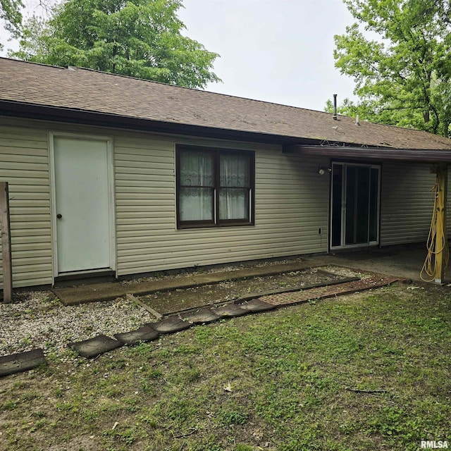 414 S Clayton St, Benton, IL 62812 - back of property with roof with shingles and a patio