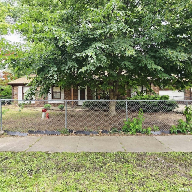 414 S Clayton St, Benton, IL 62812 - obstructed view of property with brick siding and a fenced front yard