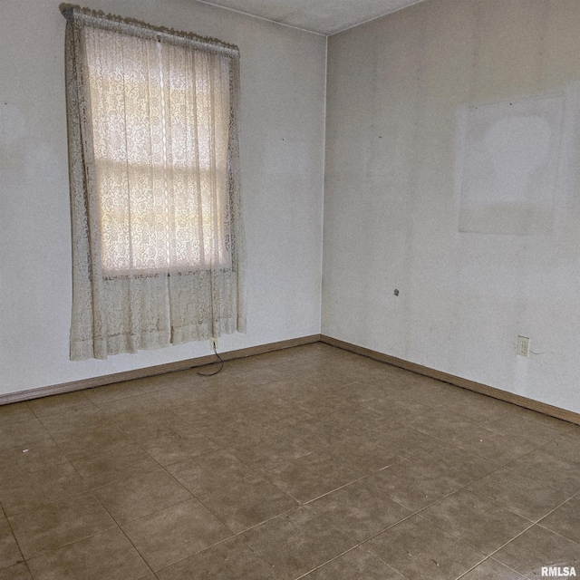 414 S Clayton St, Benton, IL 62812 - spare room featuring baseboards