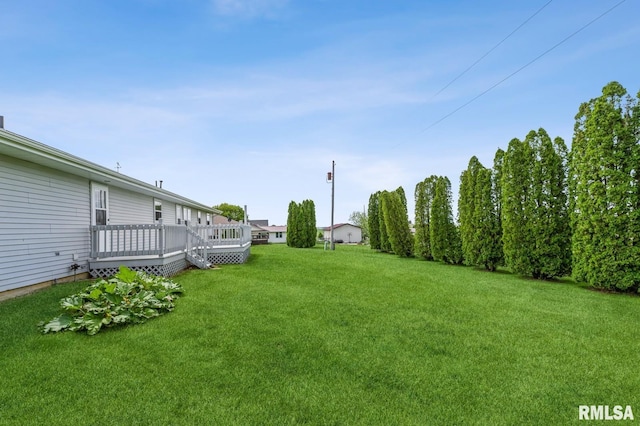 404 10th St, Lowden, IA 52255 - view of green lawn featuring a deck