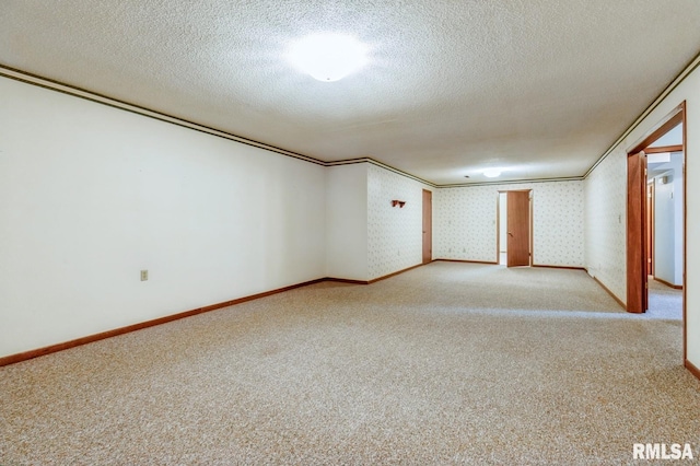 404 10th St, Lowden, IA 52255 - carpeted spare room with a textured ceiling and baseboards