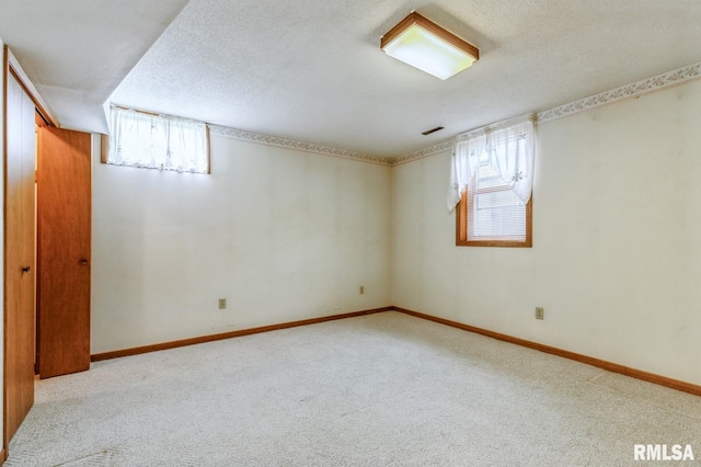 404 10th St, Lowden, IA 52255 - below grade area with carpet flooring and baseboards