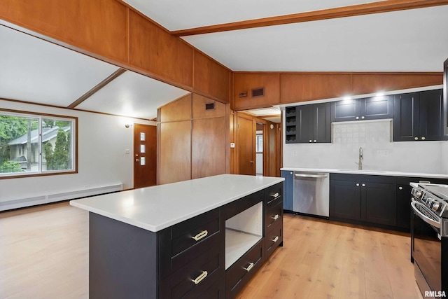 2402 Middle Rd, Davenport, IA 52803 - kitchen with appliances with stainless steel finishes, dark cabinets, a sink, light wood finished floors, and lofted ceiling